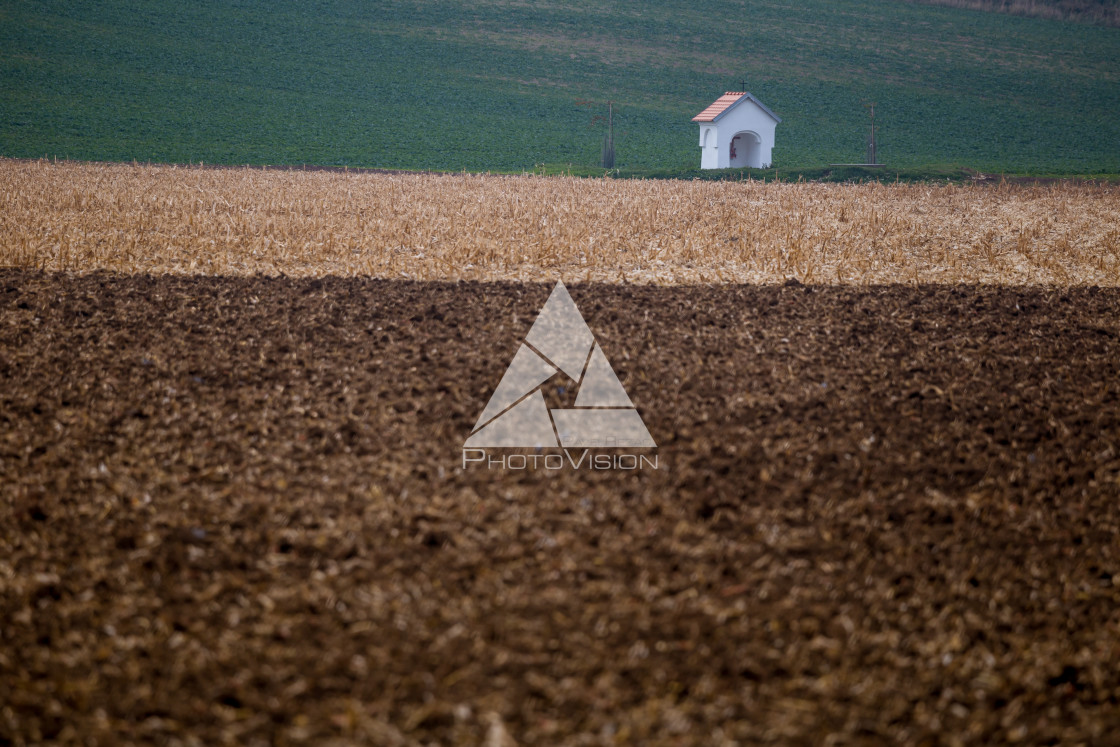 "A small chapel in autumn fields" stock image