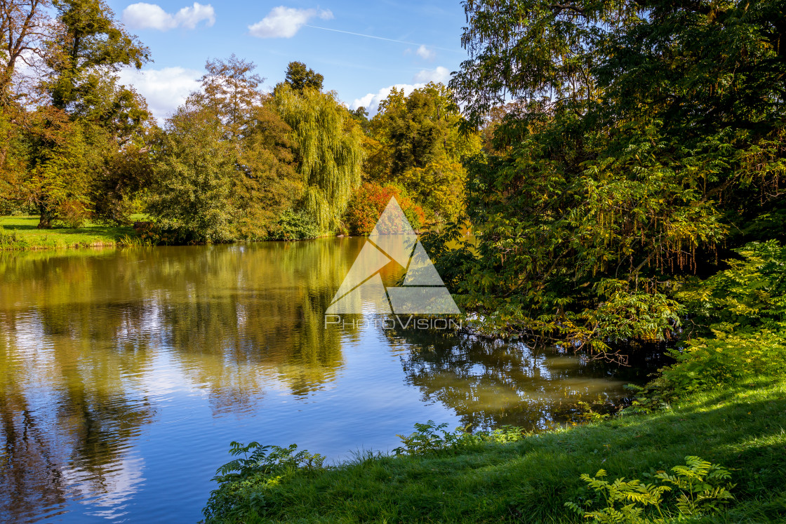 "Lake and trees in Lednice castle park" stock image