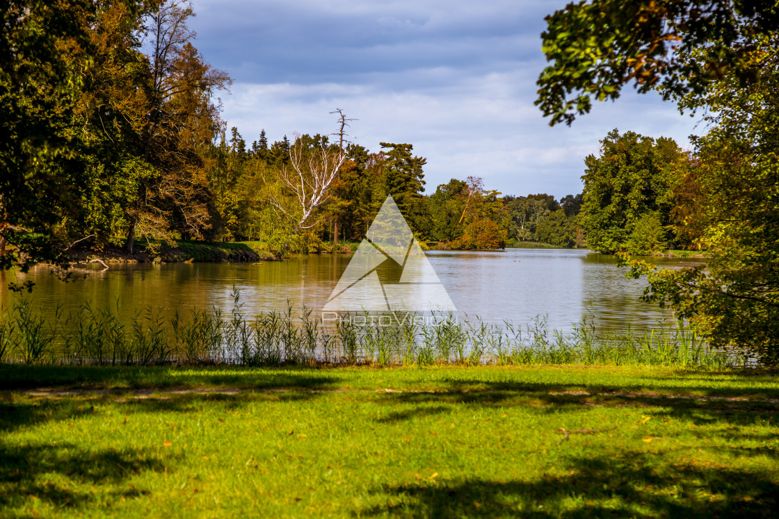 "Lake and trees in Lednice castle park" stock image