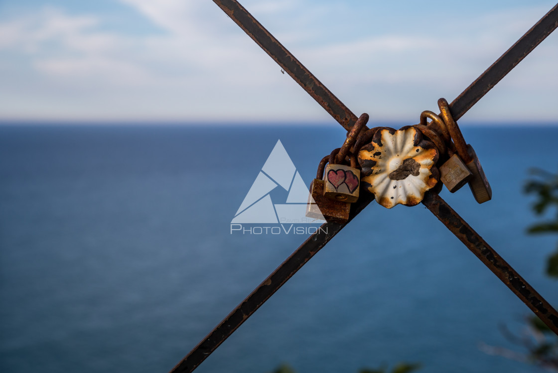 "Locks of love on a rusty fence" stock image