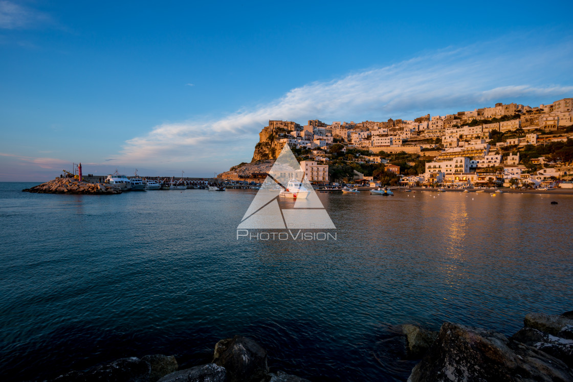 "Setting sun lit city over the sea" stock image