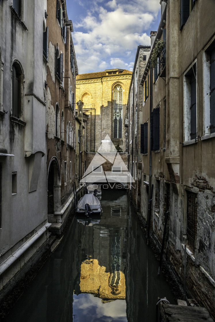 "Traditional canal street with boat in Venice" stock image