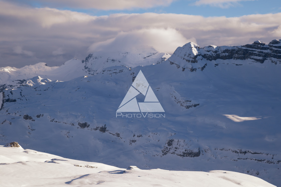 "Peaks of mountains in clouds" stock image