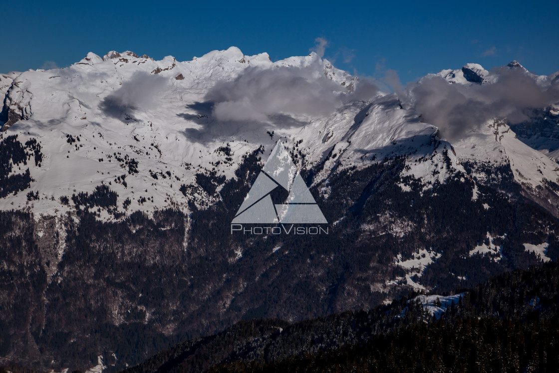 "Panorama of winter Alps with low clouds" stock image