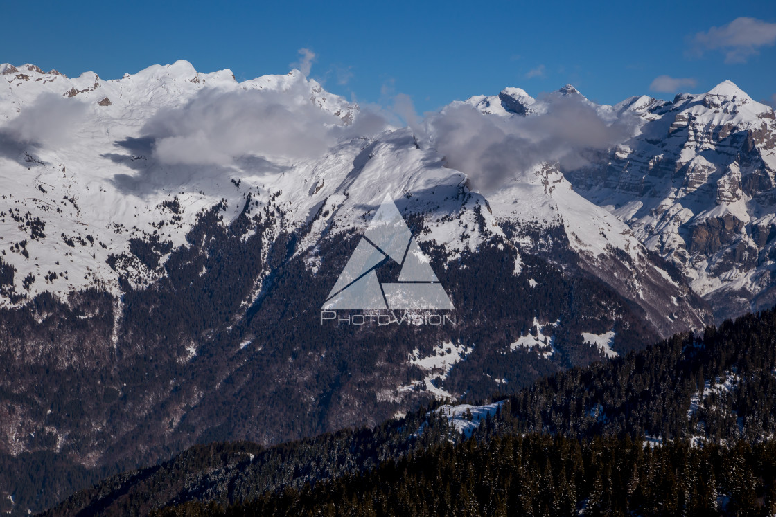 "Panorama of winter Alps with low clouds" stock image