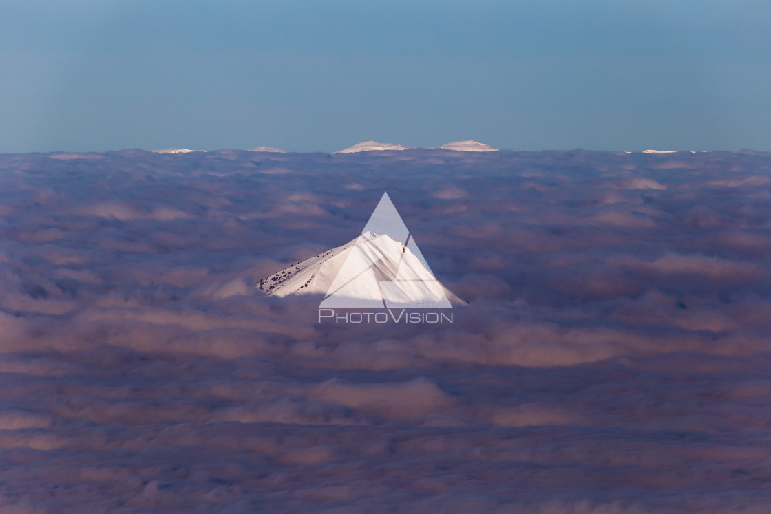 "Above the clouds, low clouds lit by the afternoon sun" stock image