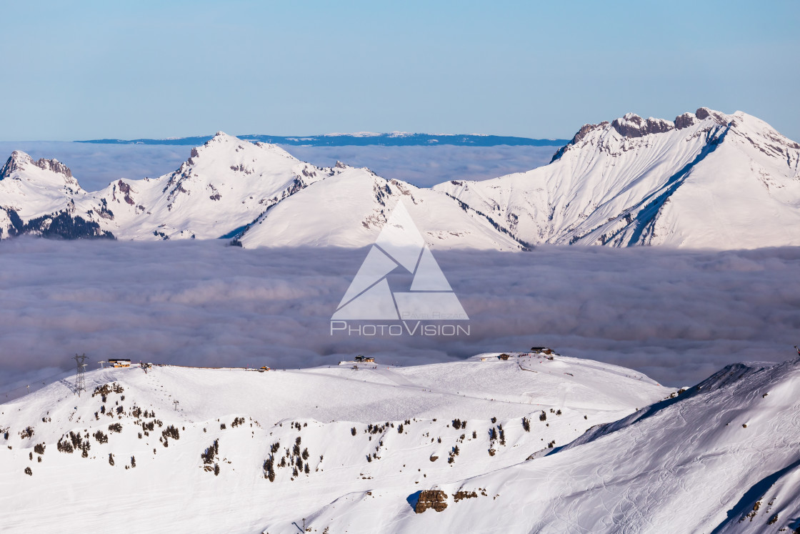 "Panorama of winter Alps with low clouds" stock image