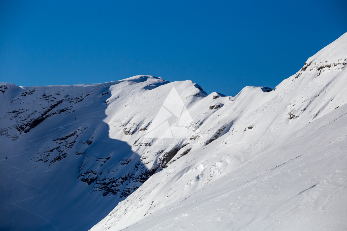 "Mountain peaks in the shade and sunlit" stock image