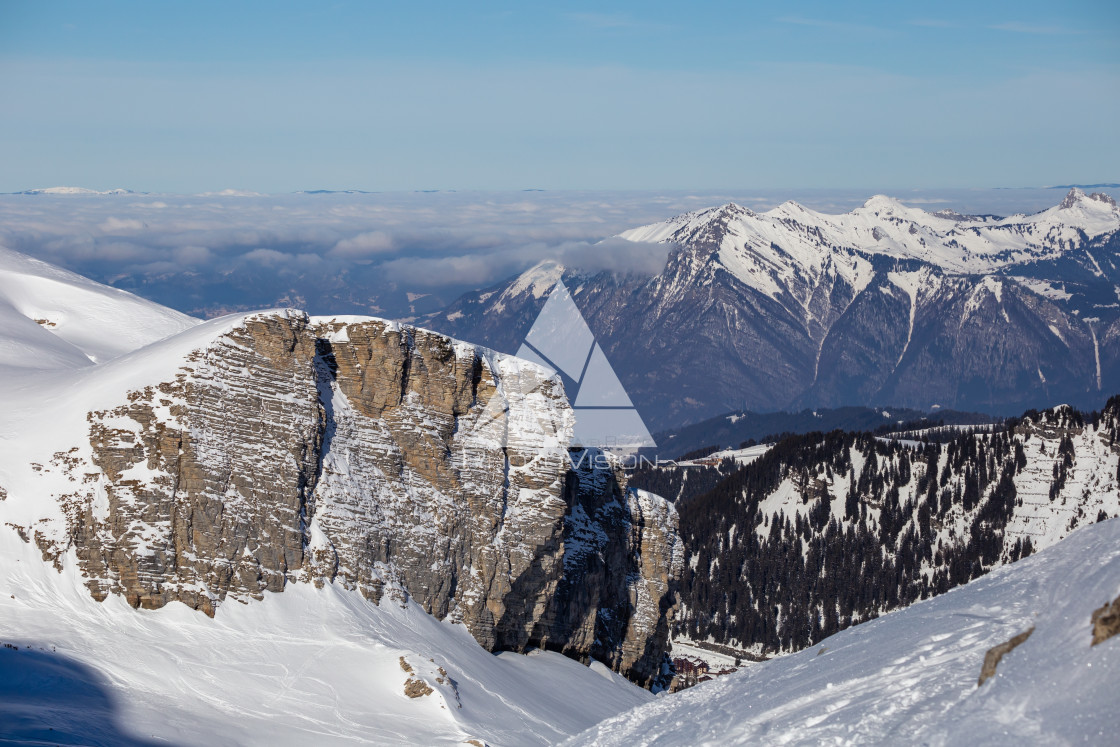 "Panorama of winter Alps with low clouds" stock image