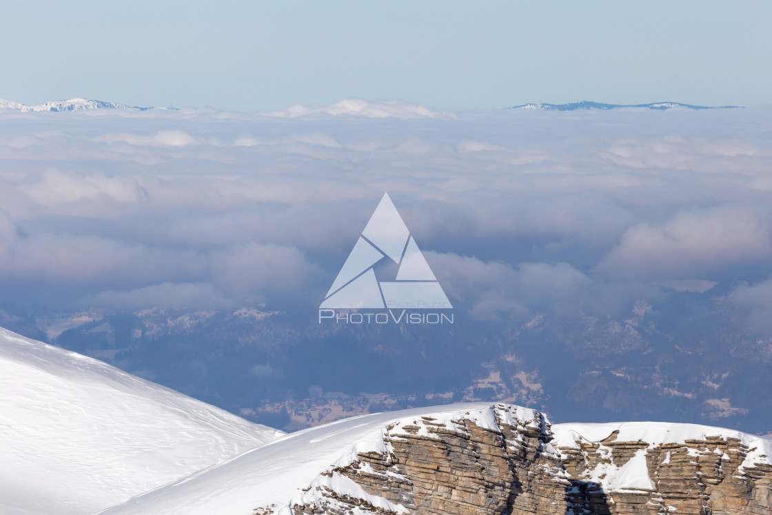 "Panorama of winter Alps with low clouds" stock image