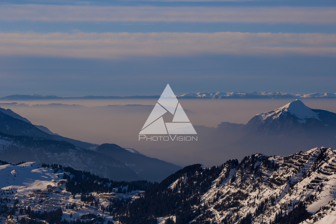 "Panorama of mountains rising from the clouds" stock image