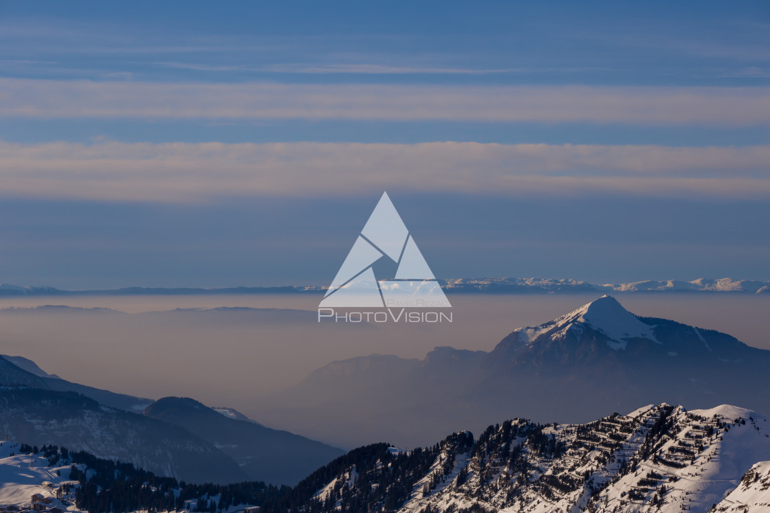 "Panorama of mountains rising from the clouds" stock image