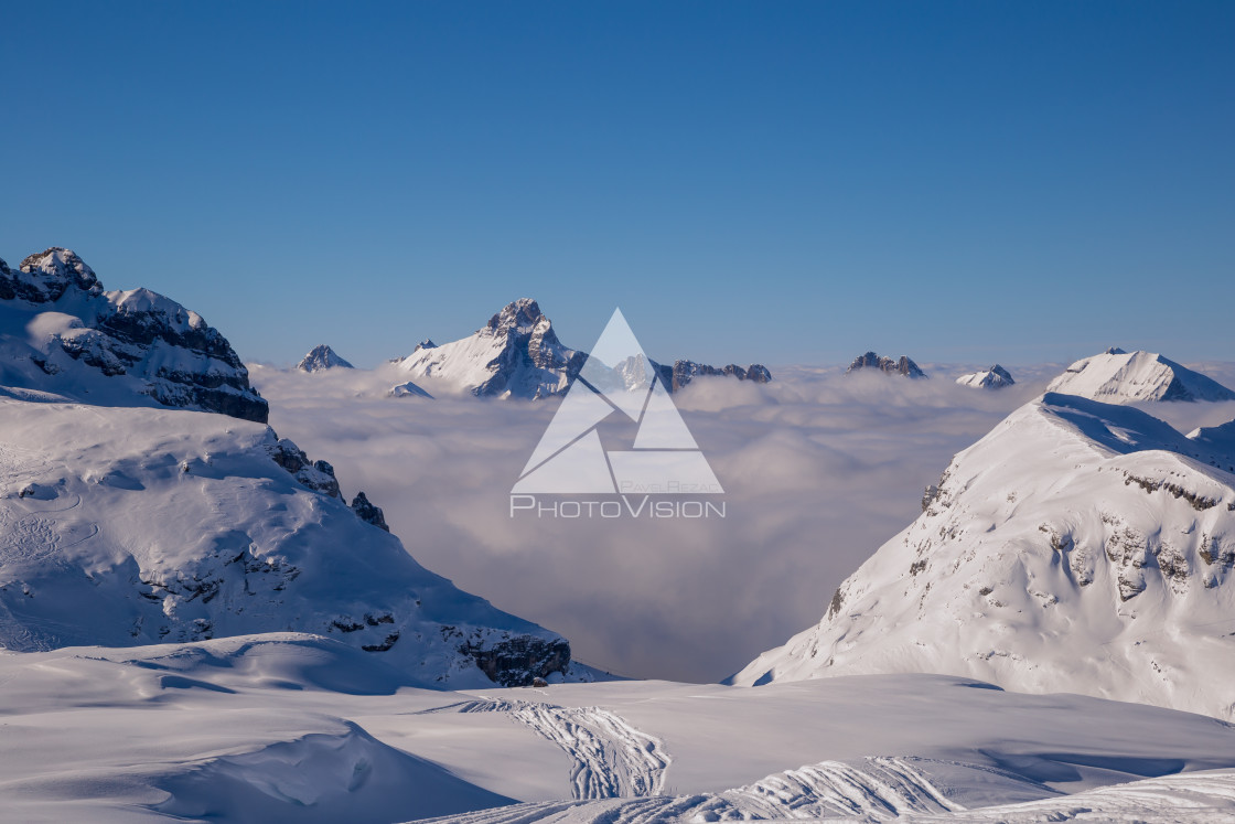 "Panorama of mountains rising from the clouds" stock image