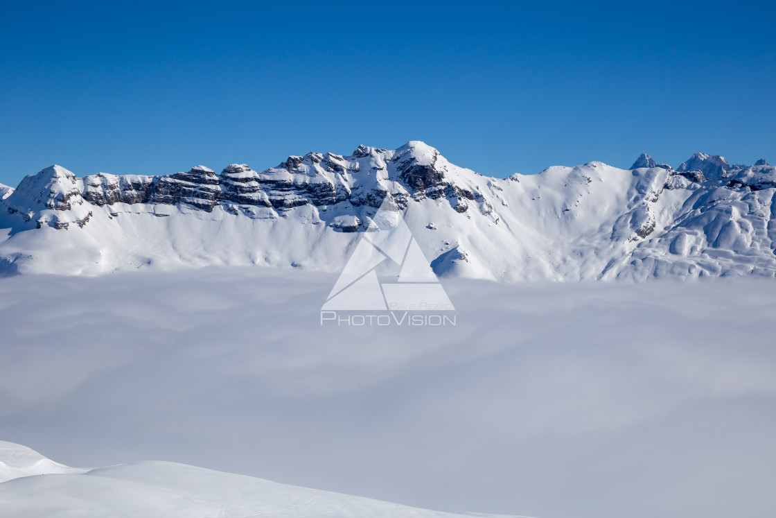 "Panorama of mountains rising from the clouds" stock image