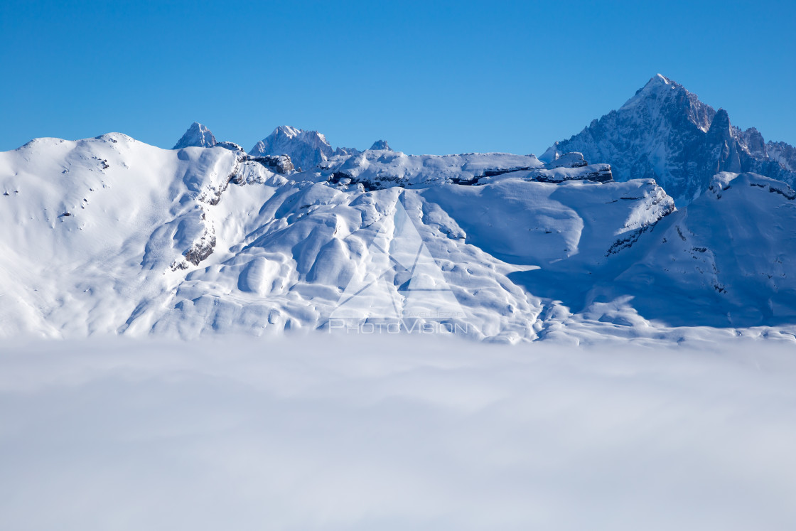 "Panorama of mountains rising from the clouds" stock image