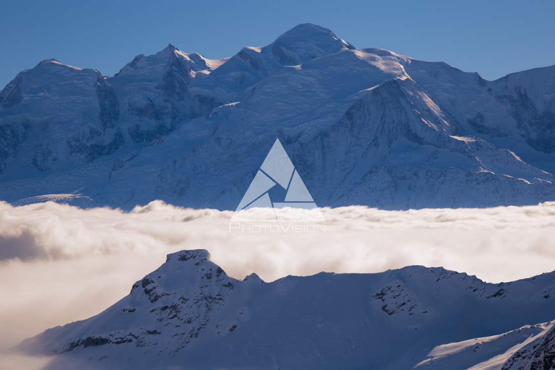 "Panorama of mountains rising from the clouds" stock image