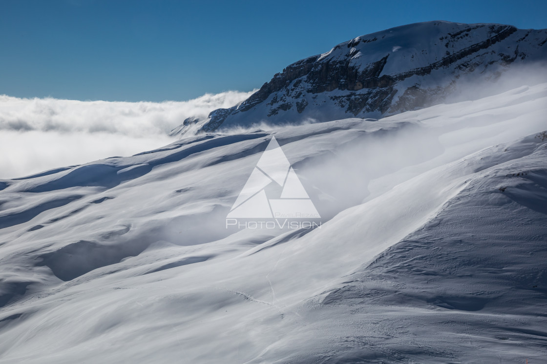 "Panorama of mountains rising from the clouds" stock image