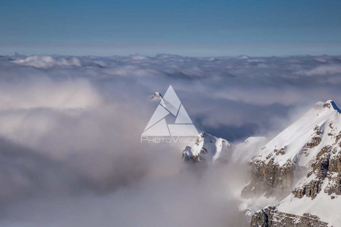 "Panorama of mountains rising from the clouds" stock image