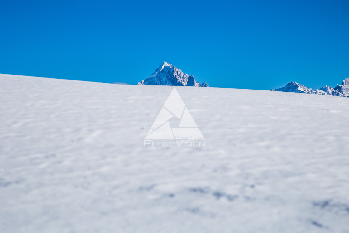 "Snowy plains and mountains, sunny day, space for text" stock image