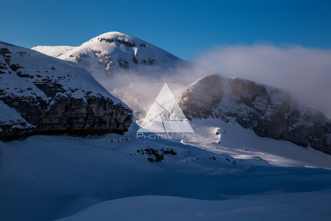 "Clouds between mountains" stock image