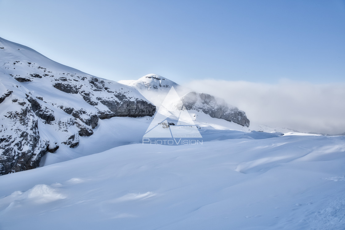 "Clouds between mountains" stock image