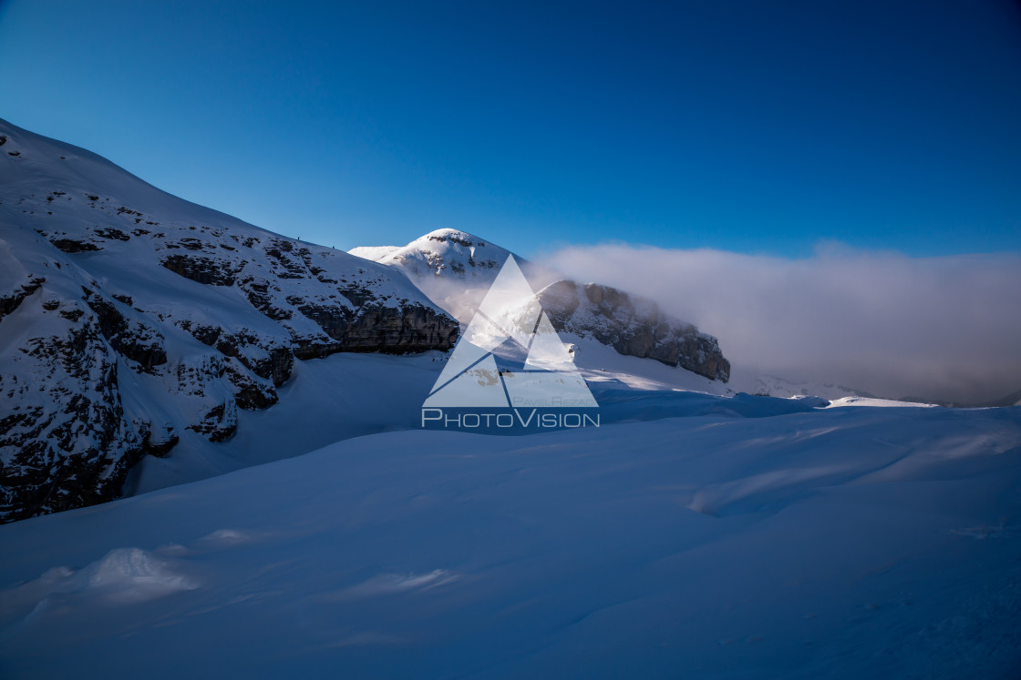 "Clouds between mountains" stock image