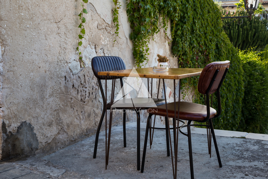 "A table and two chairs on the stairs" stock image