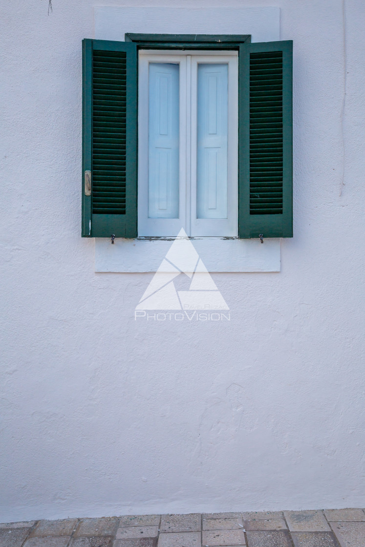 "old window on white house" stock image