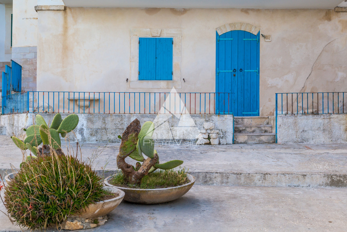 "House with blue window and door" stock image