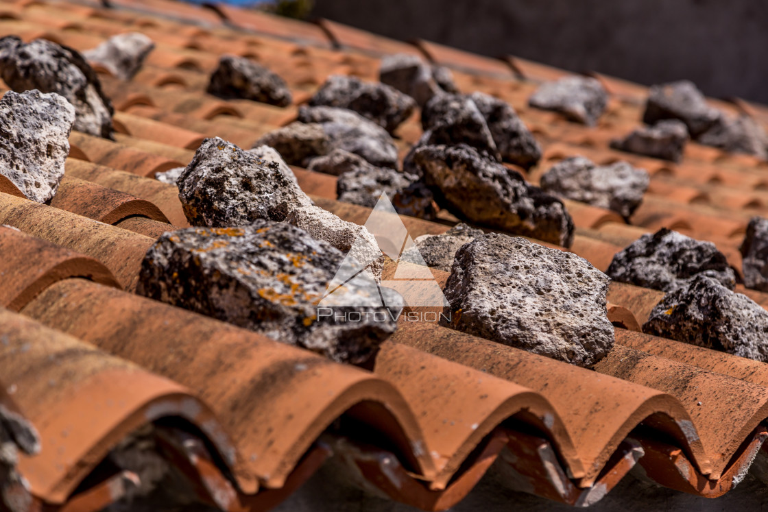 "roof tiles with stones" stock image