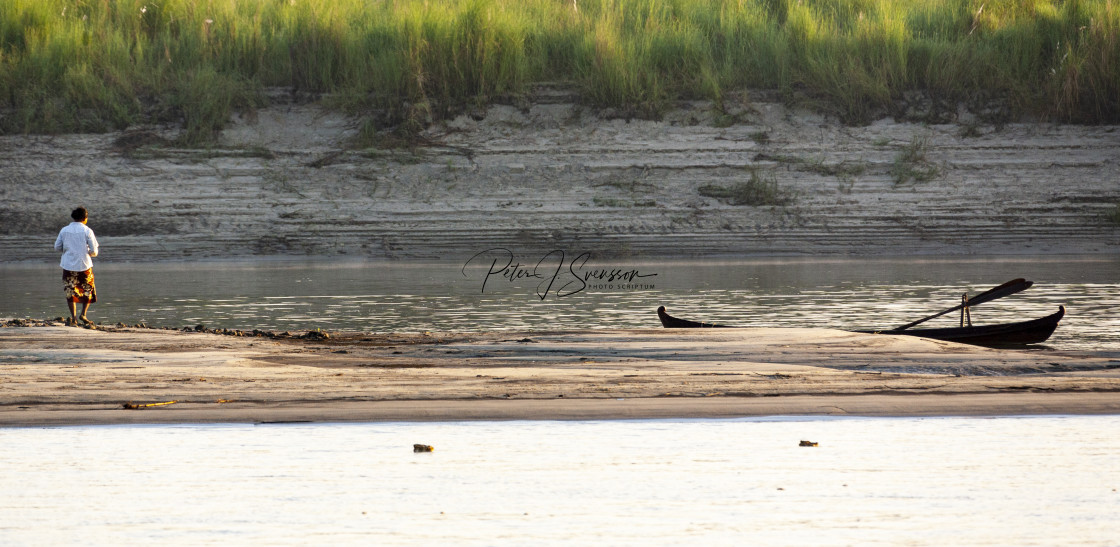 "0498 - Mandalay: woman on a sandbank in the Ayeyarwady river." stock image