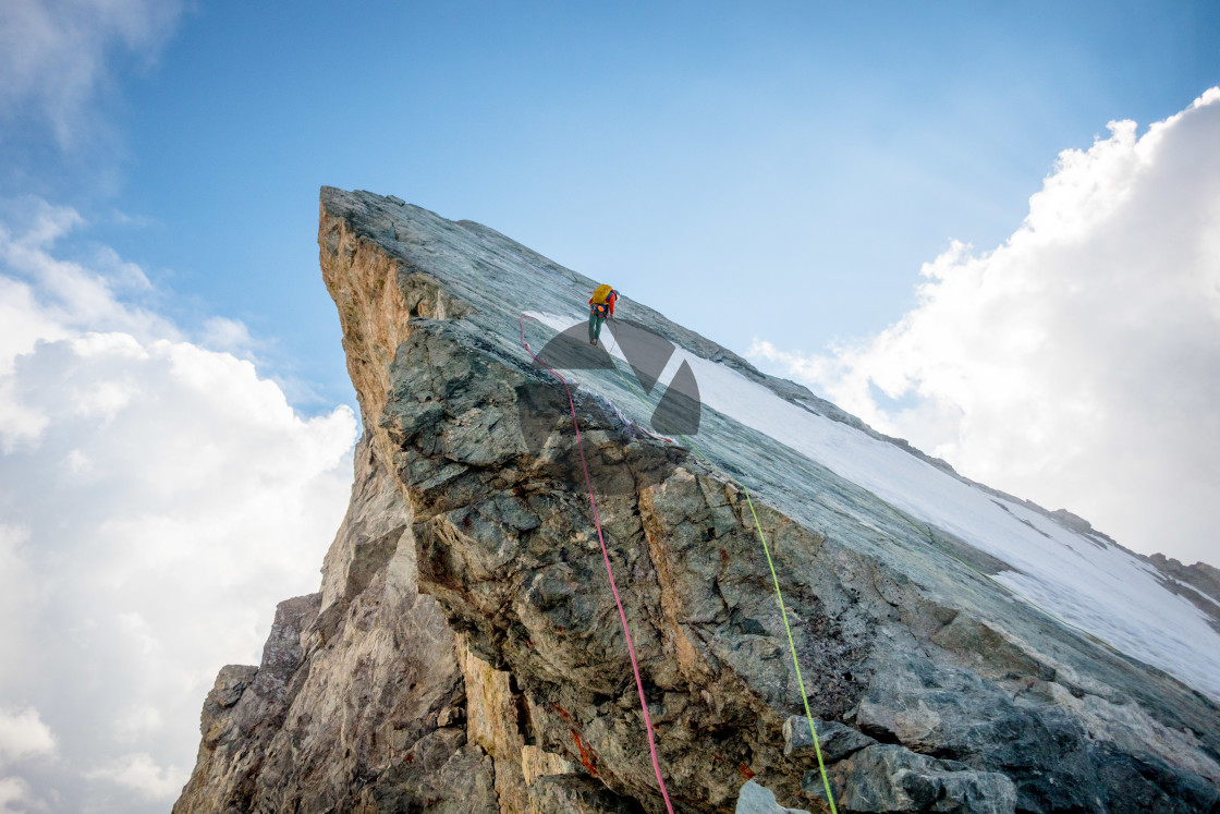"Abseiling on a sharp ridge" by Clément Garaffa Photography - $24.62 "Abseiling on a sharp ridge" stock image