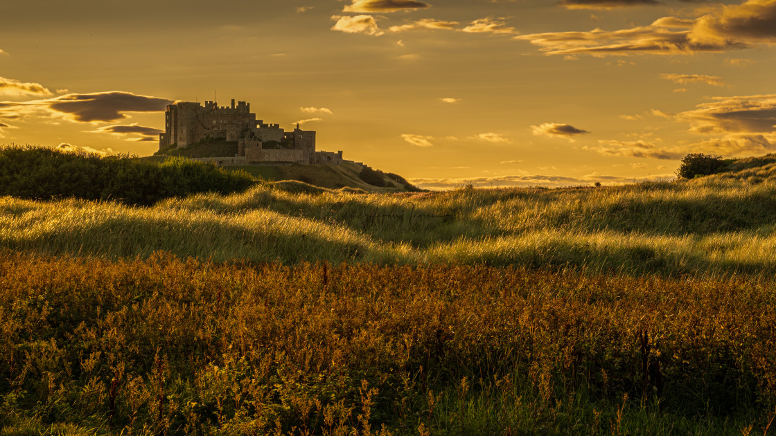 "Bamburgh Castle sunset" stock image