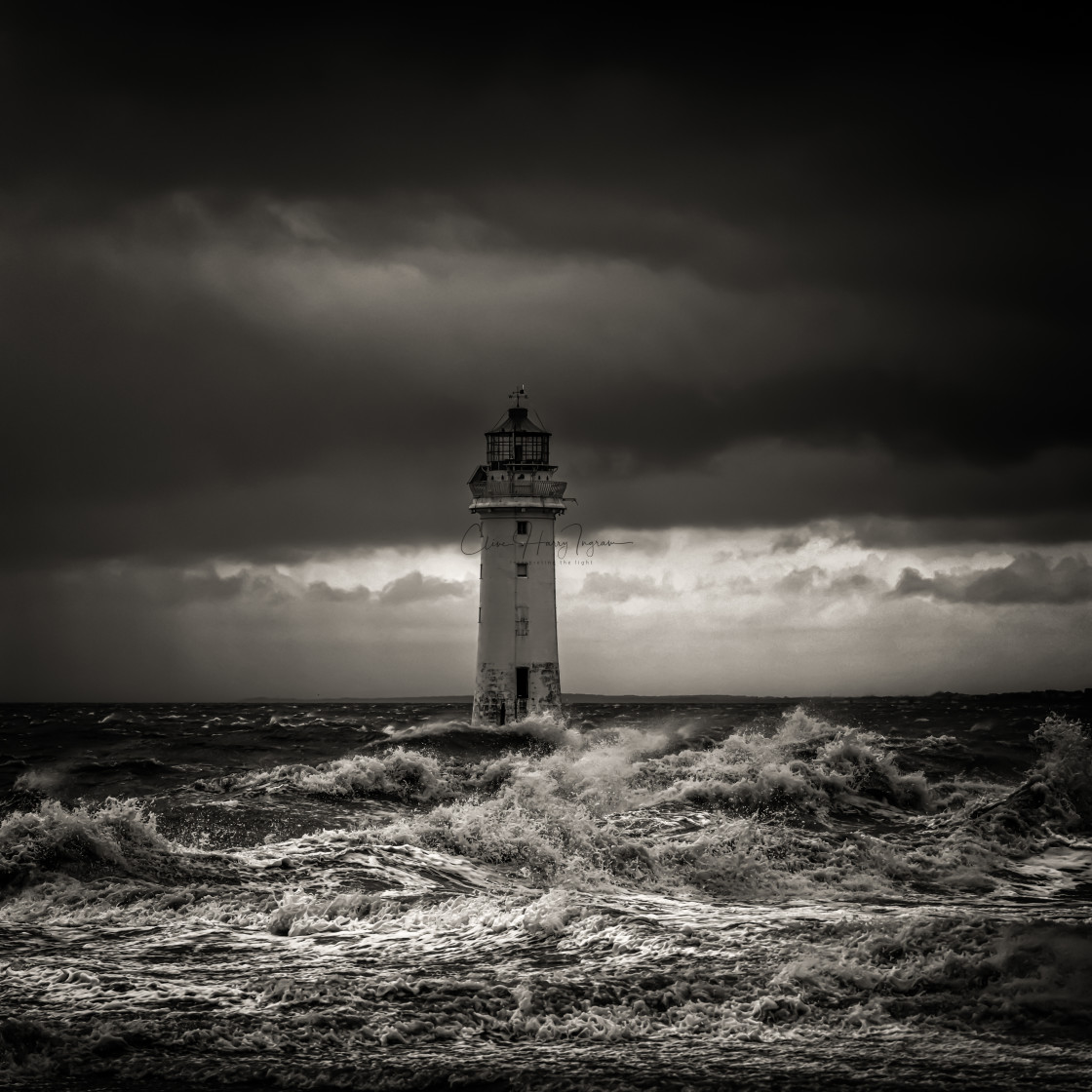 "Moody lighthouse storm scene" stock image