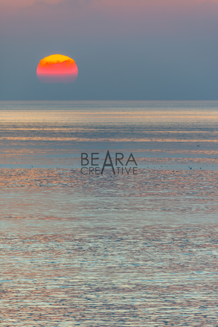 "Wales sunset over water portrait" stock image