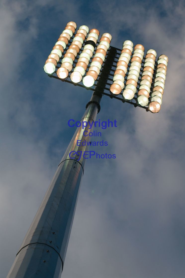 "Floodlight, switched on, against a blue sky." stock image