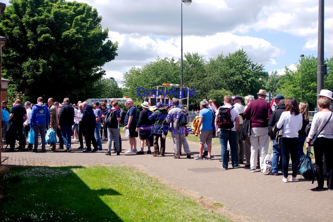 "Spectators queue for an event" stock image