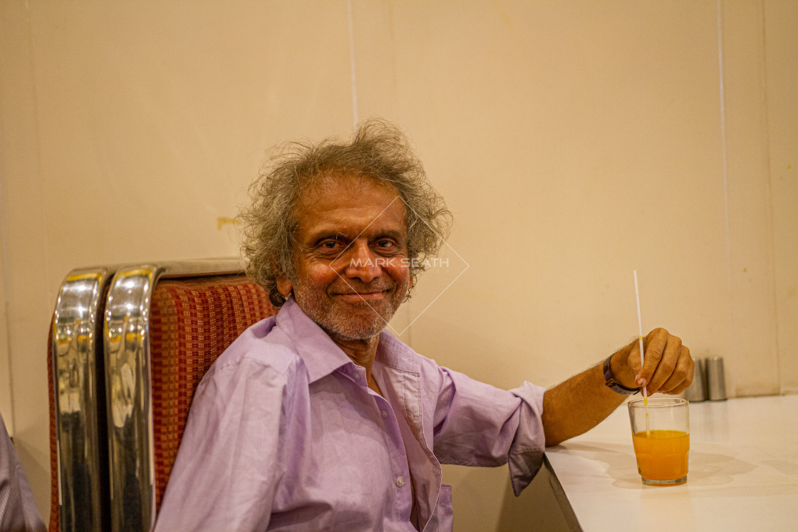 "A smiling indian man." stock image