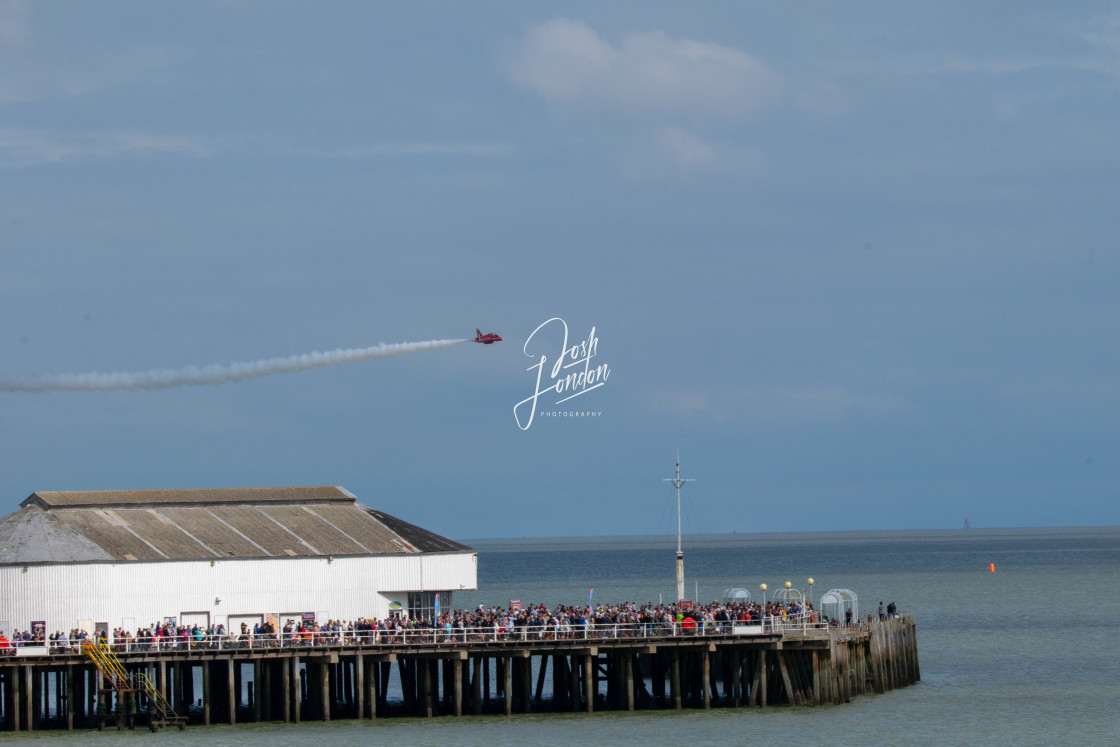 "Red arrow over Clacton pier" stock image