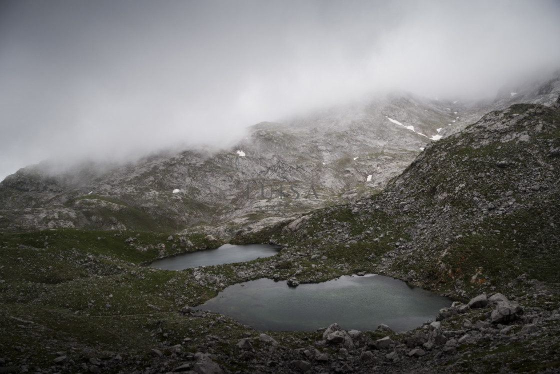 "Two small lakes lay in the middle of the hills" by Luísa Ferreira - $12.26 "Two small lakes lay in the middle of the hills" stock image