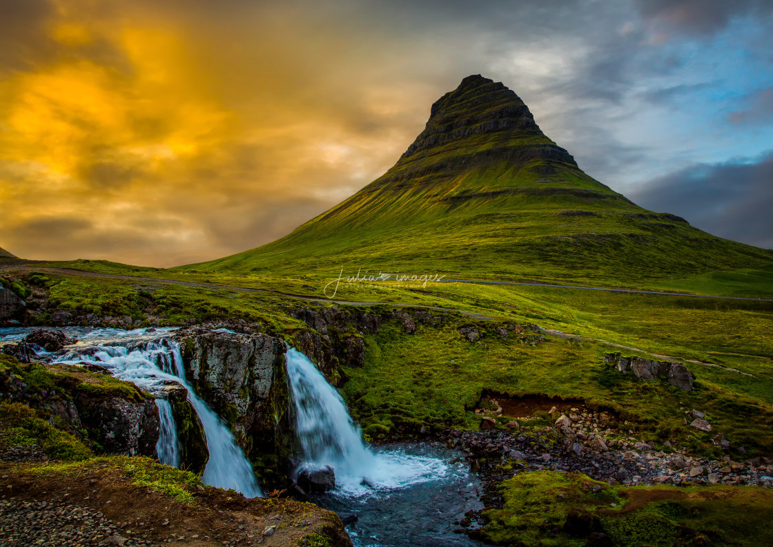 "Kirkjufell and Kirkjufellfoss waterfall at sunset" stock image