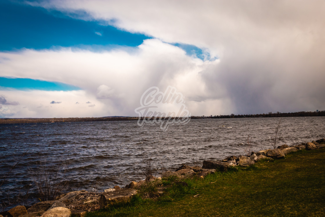 "Rain Coming in Over The River" by Colin Temple - £4.04 "Rain Coming in Over The River" stock image