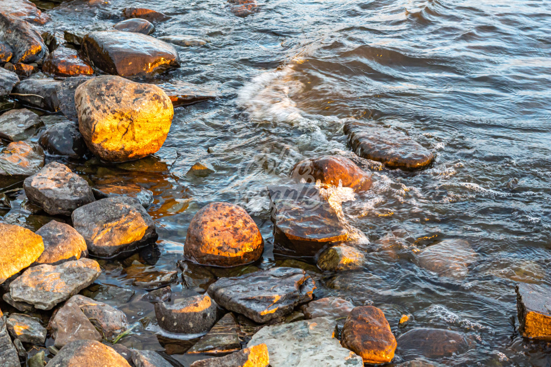 "River Waves on a Rocky Shore" by Colin Temple - £4.04 "River Waves on a Rocky Shore" stock image