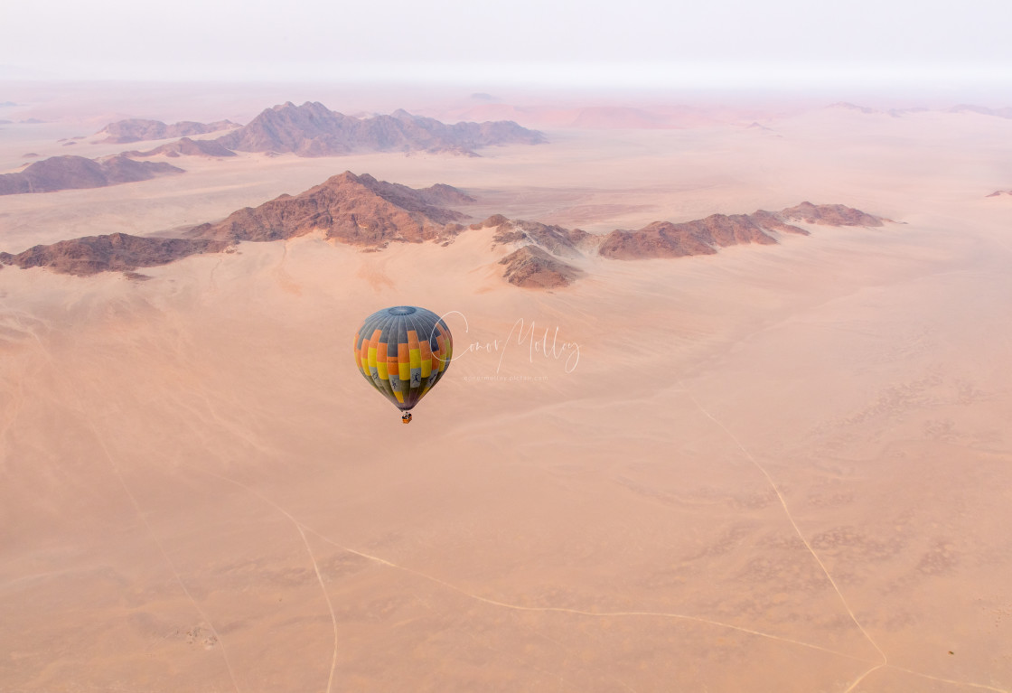 "Hot air balloon over the Namib desert" stock image