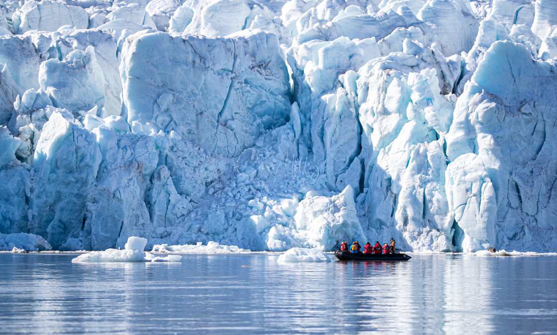 "people get close to face of a glacier" stock image