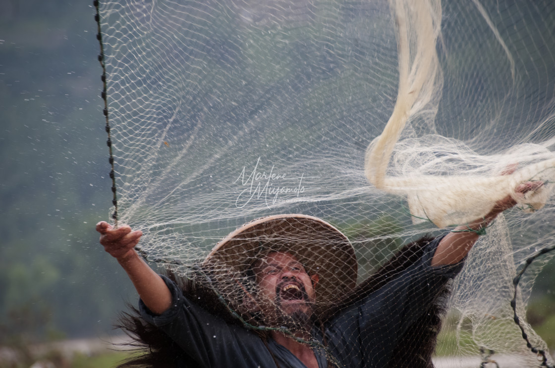 "Cormorant Fisherman Throwing His Net 1" stock image