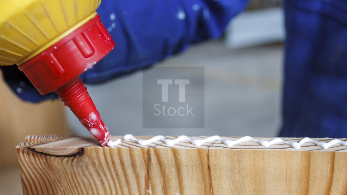 "Carpenter at work glueing" stock image