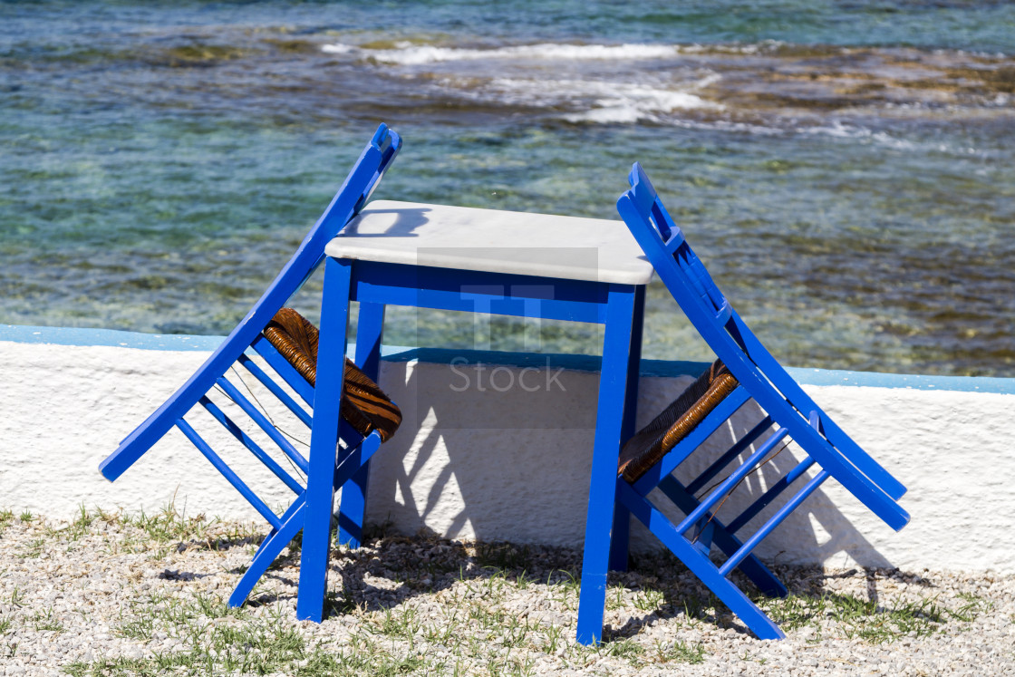 "Blue painted chairs and table" stock image