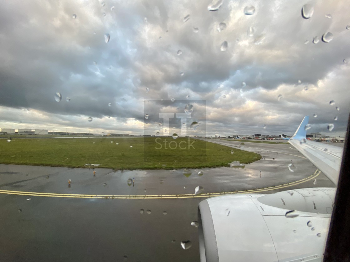 "Taxiing at Schiphol airport on a bad weather rainy day." stock image