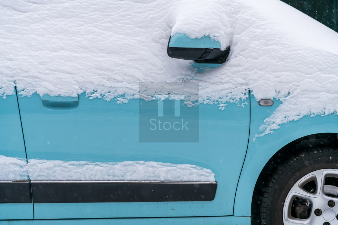 "Blue car under the snow" stock image